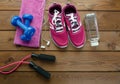 Sneakers dumbbells bottle of water and measure tape Royalty Free Stock Photo