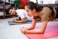 fitness couple planking together. man and woman exercising at home Royalty Free Stock Photo