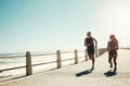 Fitness, couple and running for exercise by beach in workout, training and cardio in South Africa outdoors. Active man Royalty Free Stock Photo