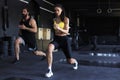 Fitness couple in sportswear doing squat exercises at gym Royalty Free Stock Photo