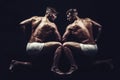 Fitness dieting and flexibility in acrobatics. Twins men with muscular body in pose. Circus gymnasts at pilates or yoga