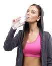 Fitness, drinking water and portrait of woman on a white background for workout, exercise and training. Serious