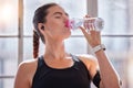 Fitness, drinking water and woman in gym for health, wellness or hydration. Sports, nutrition or thirsty female athlete Royalty Free Stock Photo