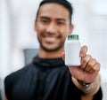 Fitness drugs, hand and a man at the gym with a supplement for training and sport. Happy, portrait and an Asian athlete