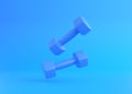 Fitness dumbbells pair. Two blue color rubber or plastic coated dumbbell weights on blue background