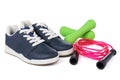 Fitness equipment concept. Sneakers, dumbbells and skipping rope