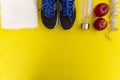 Fitness equipment. Healthy food. Sneakers, water,apple, measurin Royalty Free Stock Photo