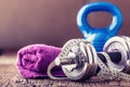 Fitness Equipment. Kettlebell dumbbells towel water and measuring tape