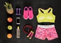 Fitness equipment objects flat lay on black floor