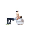 Fitness, exercise ball or man with dumbbell in studio for abs, core or balance challenge on white background. Workout Royalty Free Stock Photo