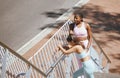 Fitness, exercise and friends stretching on stairs before running in a city together, wellness and cardio. Training Royalty Free Stock Photo