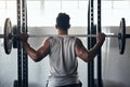 Fitness exercise in gym, man weightlifting barbell and athlete training body with heavy equipment. Strong back muscles Royalty Free Stock Photo