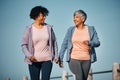 Fitness, exercise and senior women by ocean for healthy lifestyle, wellness and cardio on promenade. Sports, friends and
