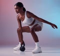 Fitness, exercise and woman with a kettlebell in studio strength training and burning calories in a full body exercise Royalty Free Stock Photo