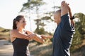 Fitness, forest and couple stretching arms for workout, commitment and healthy body. Exercise, man and woman in muscle