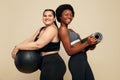 Fitness Friends. Slim And Plus Size Models. Diversity Women In Black Sportswear Holding Fitness Ball And Mat.