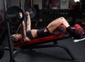 Fitness girl doing incline bench press