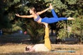 Girl doing yage dancer pose on acroyoga practicing Royalty Free Stock Photo