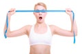 Fitness girl fit woman covering her eyes with measuring tape Royalty Free Stock Photo