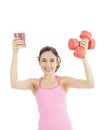 Fitness girl with a glass of smoothie and a pair of dumbbells Royalty Free Stock Photo