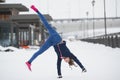 Fitness girl have acrobatic work out fitness on snow winter outdoor, sport background Royalty Free Stock Photo