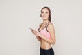 Fitness girl in headphones choose music on phone Royalty Free Stock Photo