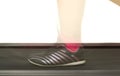 Fitness girl running on treadmill. Woman with muscular legs on w Royalty Free Stock Photo