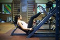 Fitness Girl. Sexy athletic girl working out in gym. Fitness woman doing exercise