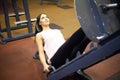 Fitness Girl. Sexy athletic girl working out in gym. Fitness woman doing exercise