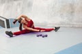 Fitness Girl Stretching On Yoga Mat. Sporty Woman In Fashion Sportswear Sits On Split Twine And Doing Exercise. Royalty Free Stock Photo