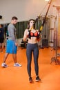 Fitness girl with working with a trainer