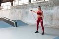 Fitness Girl. Workout With Resistance Band At Outdoor Stadium. Sexy Woman With Strong Muscular Body. Royalty Free Stock Photo