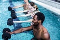 Fitness group doing aqua aerobics Royalty Free Stock Photo