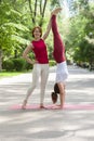 Fitness group doing yoga in park Pose tree. Workout Royalty Free Stock Photo