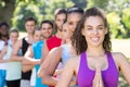 Fitness group doing yoga in park Royalty Free Stock Photo