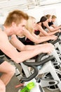 Fitness group of people on gym bike Royalty Free Stock Photo