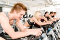 Fitness group of people on gym bike Royalty Free Stock Photo
