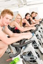 Fitness group of people on gym bike Royalty Free Stock Photo