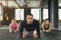 Fitness group plank training indoors