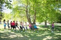 Fitness group playing tug of war Royalty Free Stock Photo