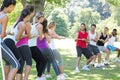 Fitness group playing tug of war Royalty Free Stock Photo