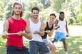 Fitness group playing tug of war Royalty Free Stock Photo