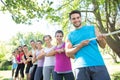 Fitness group playing tug of war Royalty Free Stock Photo