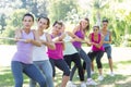 Fitness group playing tug of war Royalty Free Stock Photo