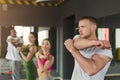 Fitness group warmup stretching training indoors