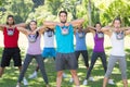 Fitness group working out in park with kettle bells Royalty Free Stock Photo