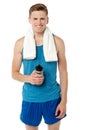 Fitness guy holding sipper bottle Royalty Free Stock Photo