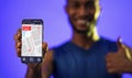 Fitness Guy Showing Smartphone With Step Counter App, Blue Background