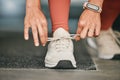 Fitness, gym or hands tie shoes to start workout, sports exercise or cardio training with running footwear. Legs Royalty Free Stock Photo