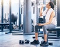 Fitness, gym and woman drinking water after workout for hydration, health and wellness training. Sports, athlete and Royalty Free Stock Photo